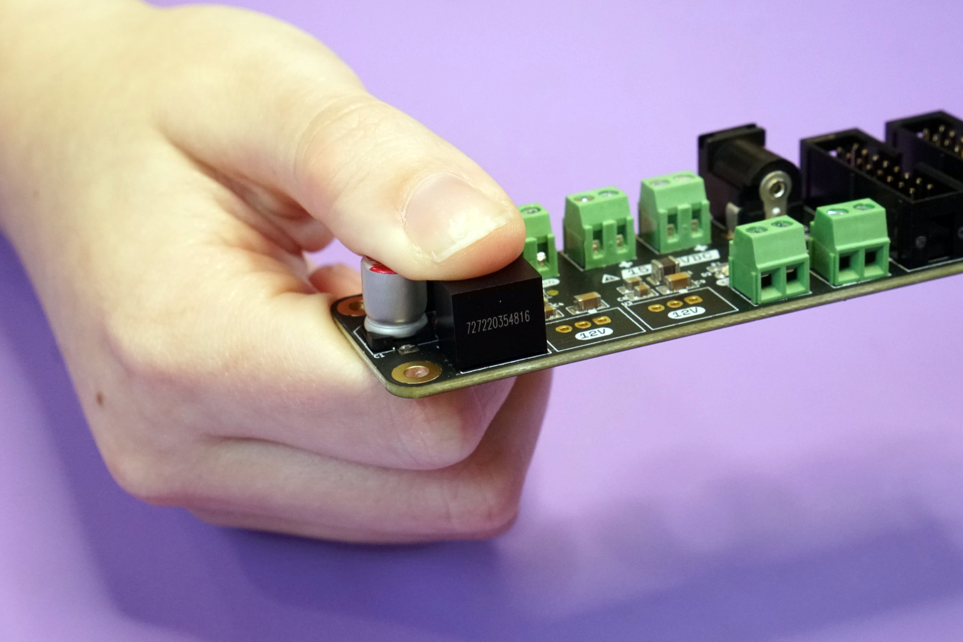 Photo of the 5V converter placed onto the front side of the board
